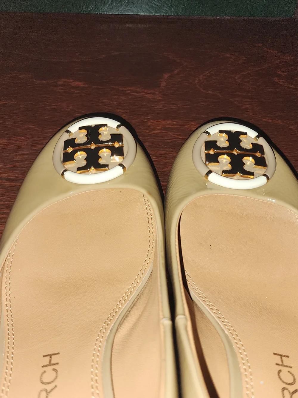 Tory Burch Beige Patent Leather Block Heel Pumps with Gold Emblem
